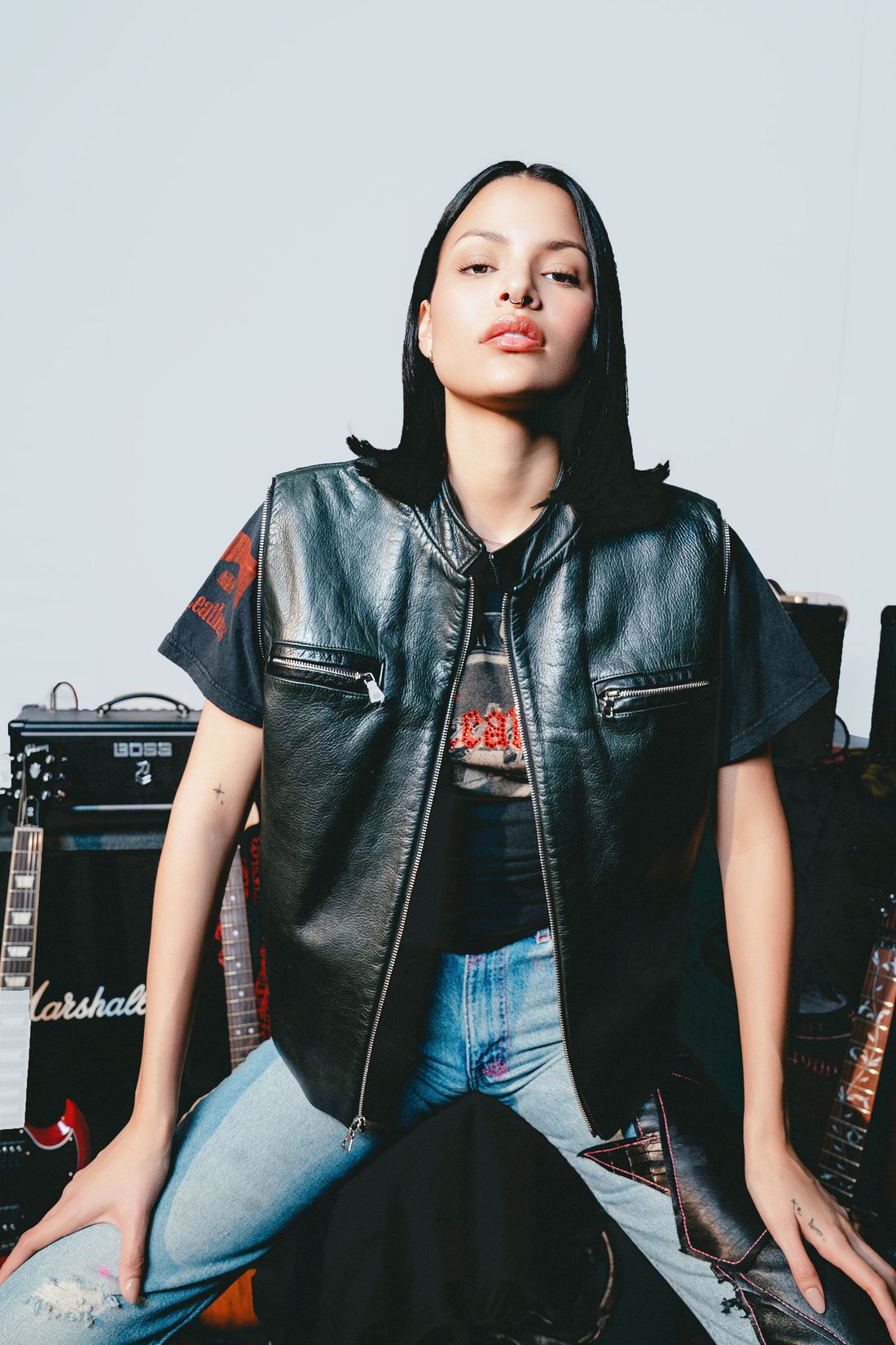 Studded and patched black leather vest.